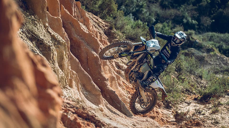 Triumph TF 250-E riding shot on a steep hill
